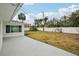 Large backyard with grassy area and patio at 956 Bruce Ave, Clearwater Beach, FL 33767