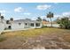 Spacious backyard with grassy area and patio at 956 Bruce Ave, Clearwater Beach, FL 33767