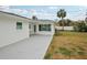 Large backyard with grassy area and patio at 956 Bruce Ave, Clearwater Beach, FL 33767