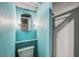 Small basement bathroom with light blue walls and toilet at 956 Bruce Ave, Clearwater Beach, FL 33767