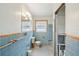 Retro bathroom with blue tile and original fixtures at 956 Bruce Ave, Clearwater Beach, FL 33767