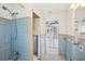 Vintage bathroom with blue tile and a bathtub at 956 Bruce Ave, Clearwater Beach, FL 33767