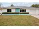 House exterior showcasing teal and white color scheme at 956 Bruce Ave, Clearwater Beach, FL 33767