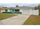 House exterior with teal accents and white siding at 956 Bruce Ave, Clearwater Beach, FL 33767