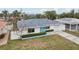 Cute single story home with teal door at 956 Bruce Ave, Clearwater Beach, FL 33767