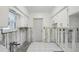 Renovation needed kitchen with white cabinets and tiled floor at 956 Bruce Ave, Clearwater Beach, FL 33767