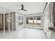 Unfinished sunroom with tiled floor and large windows at 956 Bruce Ave, Clearwater Beach, FL 33767