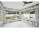 Unfinished sunroom with tiled floors and backyard view at 956 Bruce Ave, Clearwater Beach, FL 33767