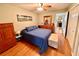 Bright bedroom with a wooden dresser and double bed at 2043 Denmark St # 57, Clearwater, FL 33763