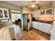 Kitchen with white cabinets, stainless steel appliances, and tile floors at 2043 Denmark St # 57, Clearwater, FL 33763