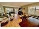 Living room with hardwood floors, couches, and a dining area at 2043 Denmark St # 57, Clearwater, FL 33763