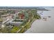 This wide aerial showcases the property's waterfront position and nearby amenities at 1101 Victoria Dr # 16, Dunedin, FL 34698