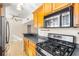 Modern kitchen featuring gas range and built-in microwave at 1101 Victoria Dr # 16, Dunedin, FL 34698