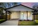 Modern craftsman style home with a covered carport at 112 W Stanley St, Tampa, FL 33604