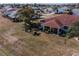 House with large backyard and surrounding neighborhood at 1207 Bluewater Dr, Sun City Center, FL 33573