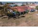 House with large backyard and surrounding neighborhood at 1207 Bluewater Dr, Sun City Center, FL 33573