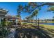 Backyard with canal view and landscaping at 1207 Bluewater Dr, Sun City Center, FL 33573