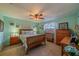 Guest bedroom with wood furniture and decor at 1207 Bluewater Dr, Sun City Center, FL 33573