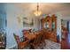 Cozy dining area with wooden table and hutch at 1207 Bluewater Dr, Sun City Center, FL 33573
