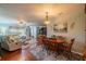 Charming dining room with hardwood floors and wooden table at 1207 Bluewater Dr, Sun City Center, FL 33573