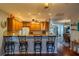 Kitchen boasts a breakfast bar and light wood cabinets at 1207 Bluewater Dr, Sun City Center, FL 33573