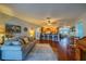 Open living area with hardwood floors and view of kitchen at 1207 Bluewater Dr, Sun City Center, FL 33573