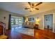Living room with hardwood floors and sliding glass doors at 1207 Bluewater Dr, Sun City Center, FL 33573