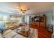 Open living room with hardwood floors and built-in shelving at 1207 Bluewater Dr, Sun City Center, FL 33573