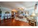 Spacious living room with hardwood floors and comfy seating at 1207 Bluewater Dr, Sun City Center, FL 33573