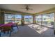 Sunroom with water views and seating area at 1207 Bluewater Dr, Sun City Center, FL 33573