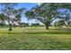 Landscaped backyard with view of golf course at 12200 Vonn Rd # 1106, Largo, FL 33774