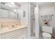 Clean bathroom with shower, toilet and vanity at 12200 Vonn Rd # 1106, Largo, FL 33774