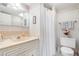 Clean bathroom with shower, toilet and vanity at 12200 Vonn Rd # 1106, Largo, FL 33774