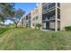 Building exterior showcasing multiple units and landscaping at 12200 Vonn Rd # 1106, Largo, FL 33774