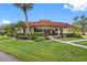 Well-maintained community mailroom building with lush landscaping at 12200 Vonn Rd # 1106, Largo, FL 33774