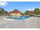 Refreshing community pool with surrounding deck and seating at 12200 Vonn Rd # 1106, Largo, FL 33774