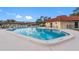 Sparkling community pool with pool house and ample seating at 12200 Vonn Rd # 1106, Largo, FL 33774