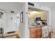 Bright dining area with table and chairs next to kitchen at 12200 Vonn Rd # 1106, Largo, FL 33774