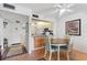 Dining area with table and chairs and view of kitchen at 12200 Vonn Rd # 1106, Largo, FL 33774
