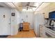 Kitchen with wood cabinets and white appliances at 12200 Vonn Rd # 1106, Largo, FL 33774