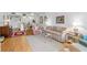 Living room with hardwood floors and view to kitchen at 12200 Vonn Rd # 1106, Largo, FL 33774