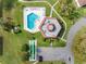 Community pool with surrounding green space at 12200 Vonn Rd # 1106, Largo, FL 33774