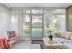Sunroom with patio access and golf course view at 12200 Vonn Rd # 1106, Largo, FL 33774