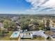 Aerial view of community pool, shuffleboard, and clubhouse at 12400 Park Blvd # 118, Seminole, FL 33772
