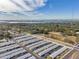 Aerial view of community with waterfront in background at 12400 Park Blvd # 118, Seminole, FL 33772