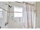 Clean bathroom with shower stall and seashell-themed curtain at 12400 Park Blvd # 118, Seminole, FL 33772