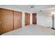 Bright bedroom with mirrored closet doors and ceiling fan at 12400 Park Blvd # 118, Seminole, FL 33772