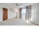 Bright bedroom featuring a window with floral curtains at 12400 Park Blvd # 118, Seminole, FL 33772