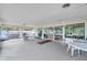 Relaxing covered patio with seating and grilling area at 12400 Park Blvd # 118, Seminole, FL 33772