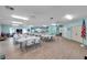 Spacious community room with tables and kitchen at 12400 Park Blvd # 118, Seminole, FL 33772